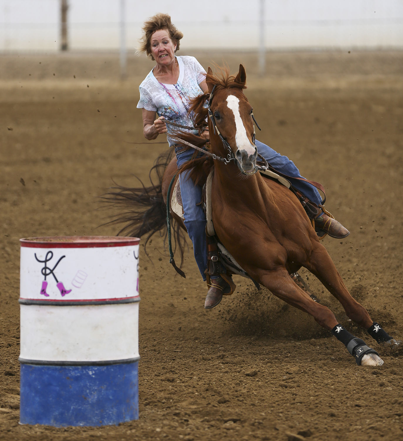 Mary Vroman looks for her turn around the first barrel during her run